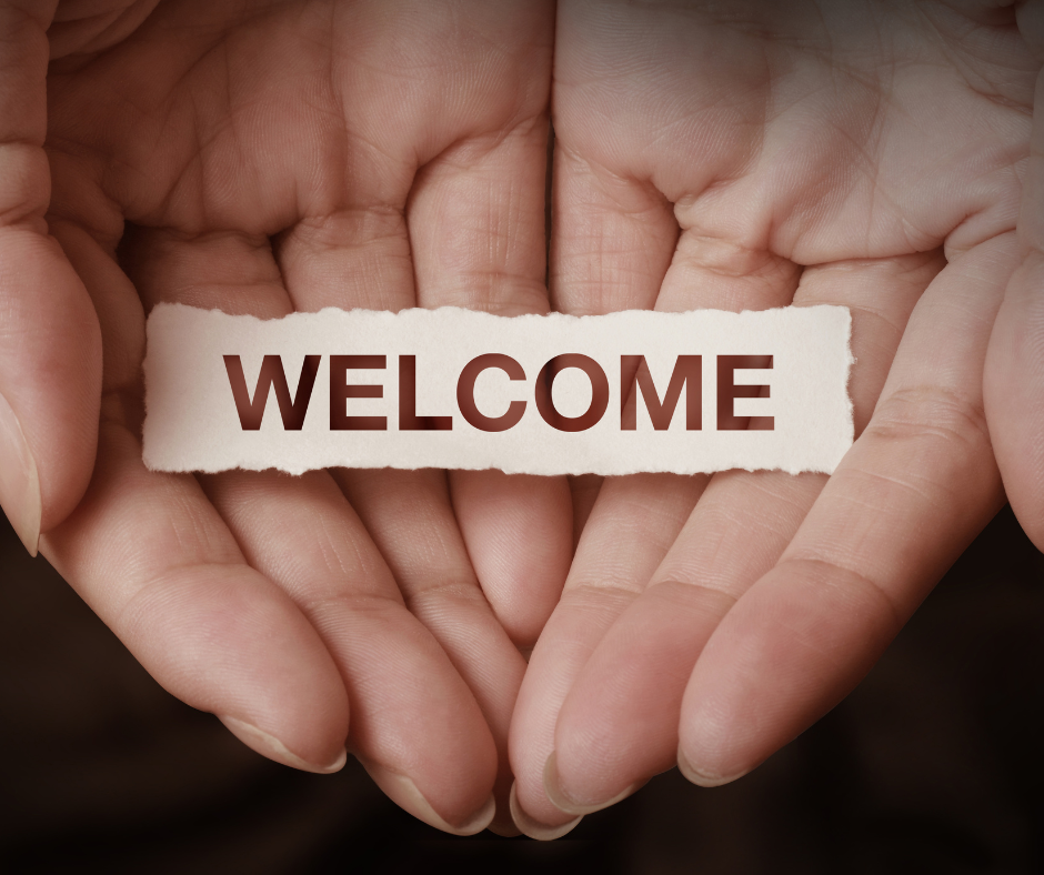 Two hands cupped together with the words 'welcome' overlaid over the top